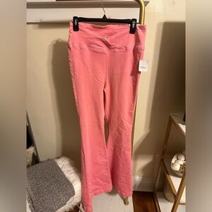 Peach Free People stretch bell bottom pants - size 28. Tag still on. Never worn.